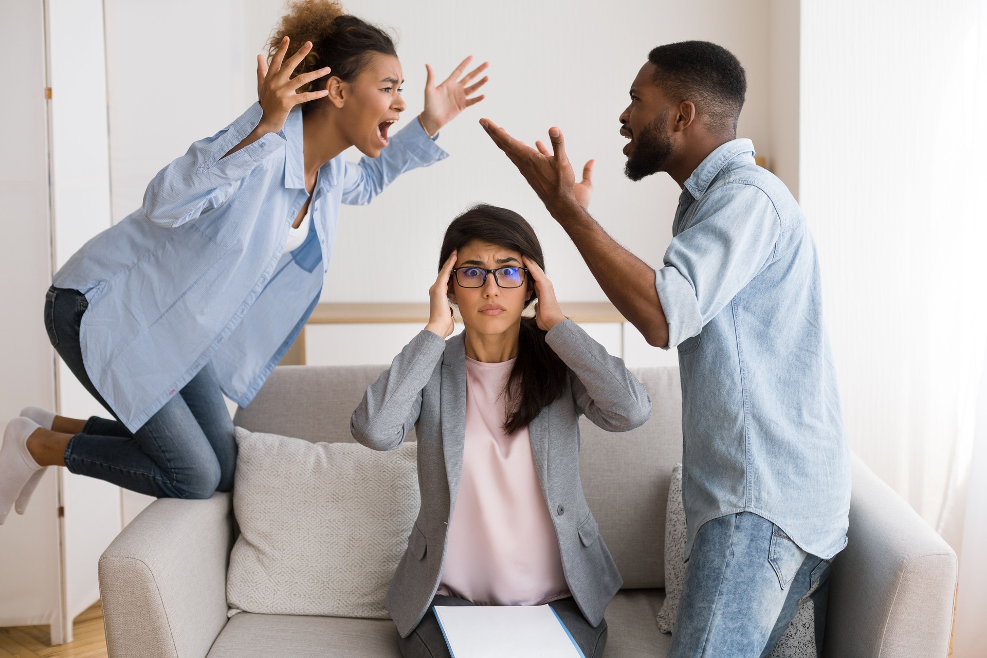 Shocked Psychotherapist Watching Black Spouses Shouting And Blaming Each Other